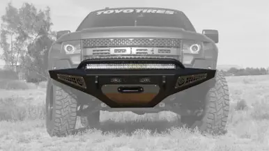 Addictive Desert Designs 10-14 Ford F-150 Raptor HoneyBadger Front Bumper w/ Winch Mount - F017275050103 Direct From Factory